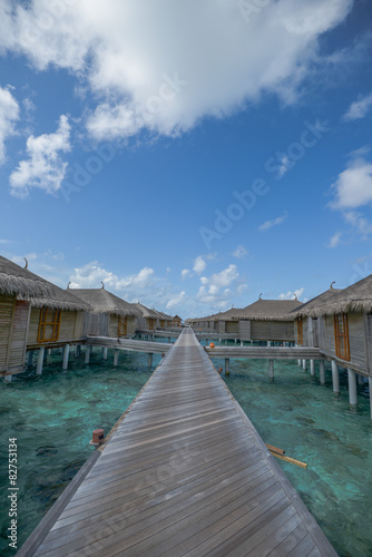 Over water resort in Maldives with blue sky