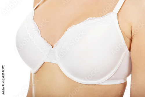Woman breast in white bra.