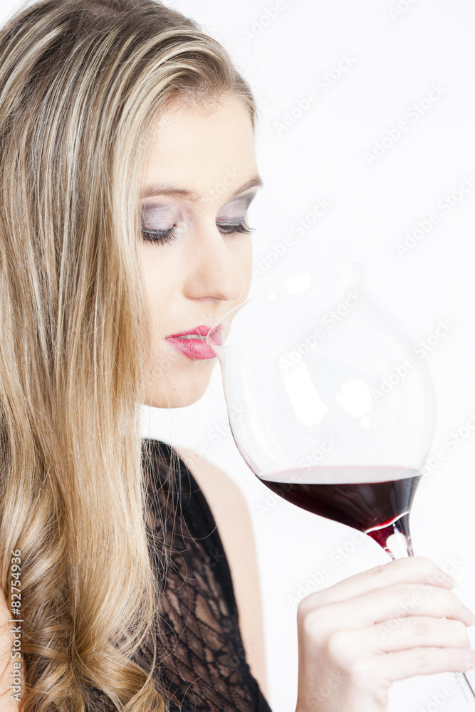 portrait of young woman drinking red wine portrait of young woman drinking red wine
