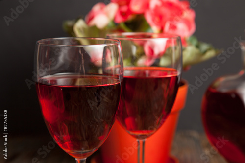  glass with red wine and flower