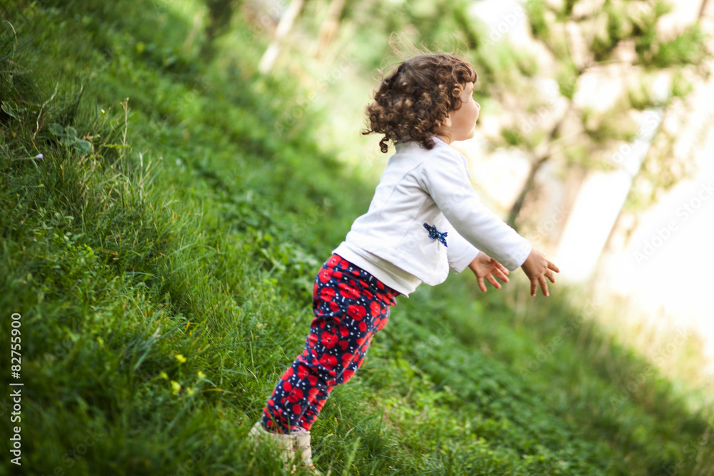 Little girl playing in nature on a spring day Little girl playing in nature on a spring day