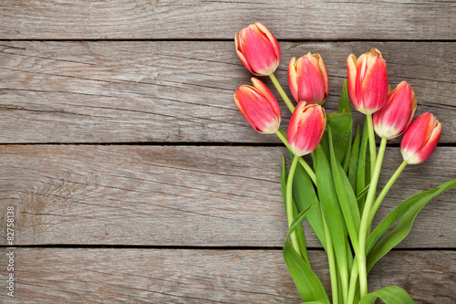 Colorful tulips on wooden table