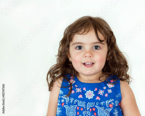 Beautiful toddler in a flowered dress