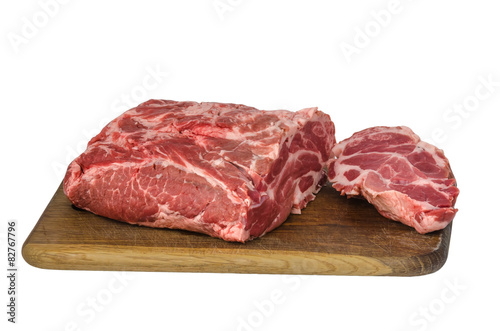 Raw meat on cutting board isolated on white