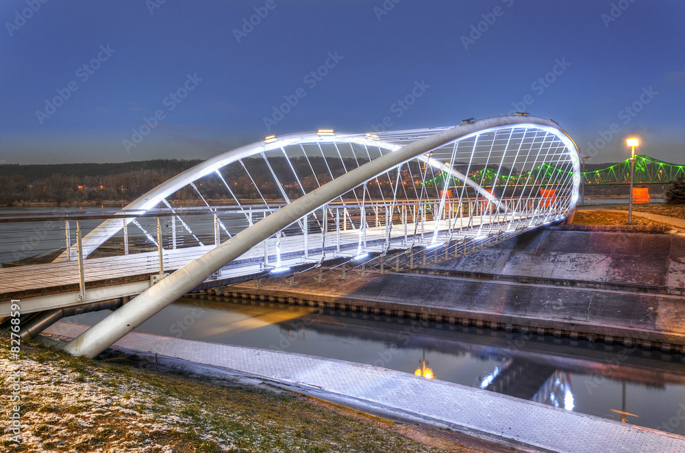 Illuminated footbridge over Zglowiaczka River in Wloclawek