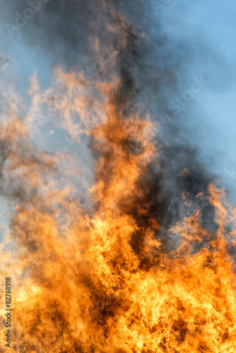 Big fire and flames with a blue sky © stefanholm