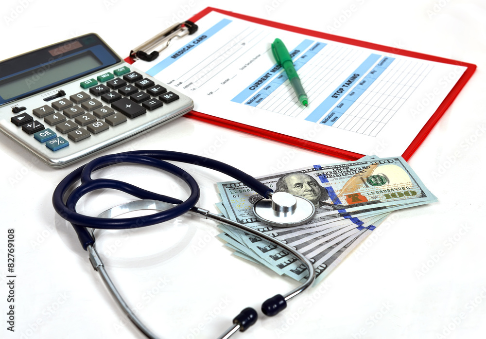 Stethoscope and dollar bills Stethoscope and dollar bills