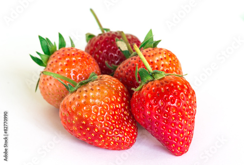 Ripe strawberries on a white background