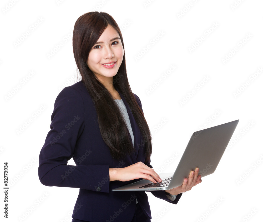 Young businesswoman use of the notebook computer Young businesswoman use of the notebook computer