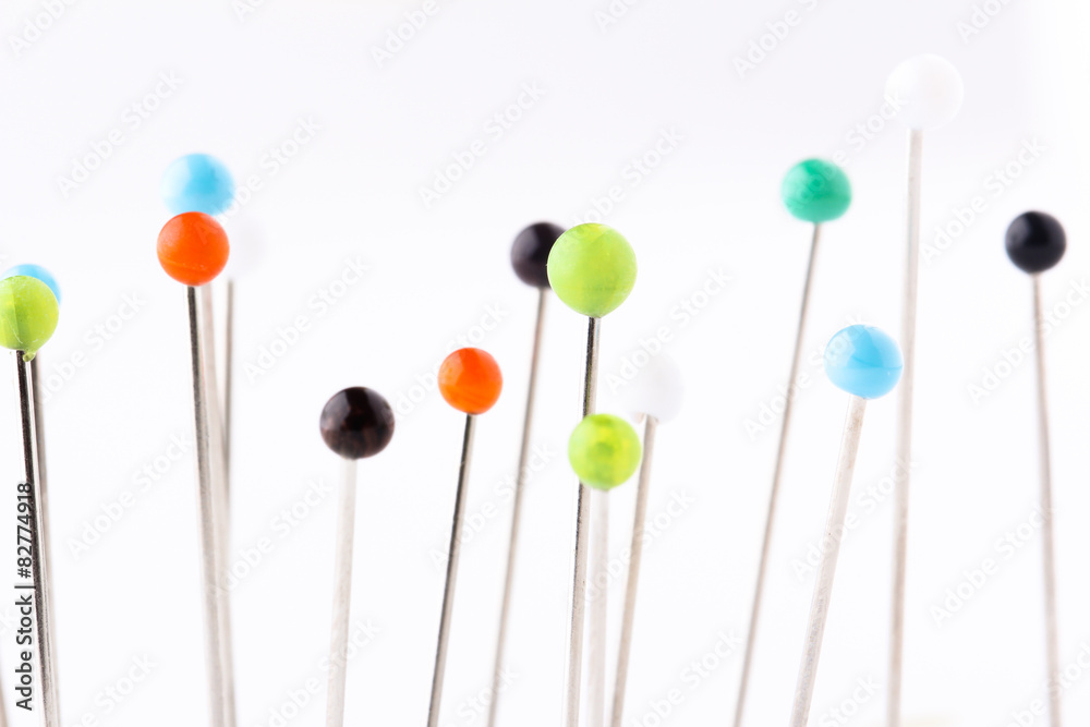 Many sewing push pins isolated on white background Many sewing push pins isolated on white background