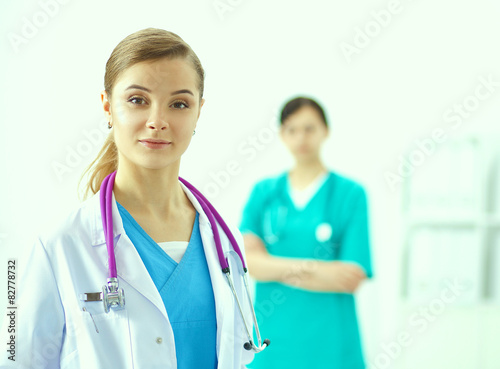 Woman doctor standing with stethoscope at hospital