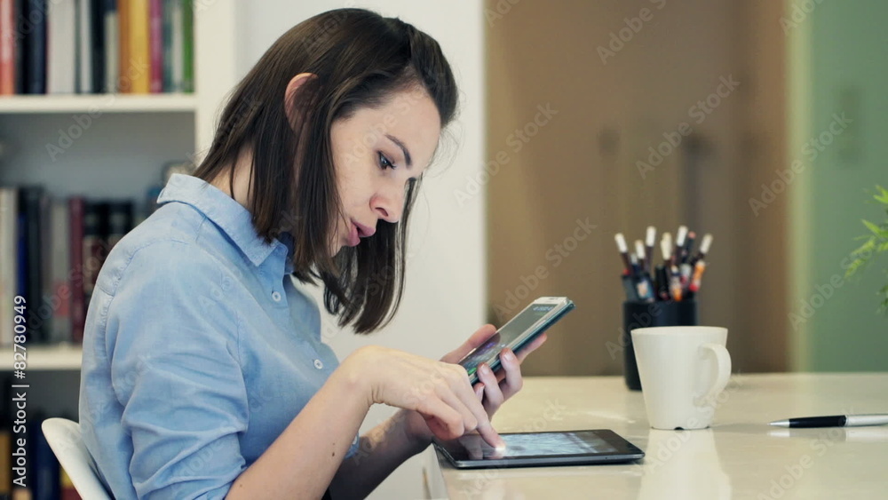 Businesswoman with tablet computer calculating data
Businesswoman with tablet computer calculating data