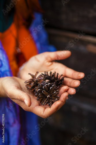 fir-cone in woman hand, Ecology concept