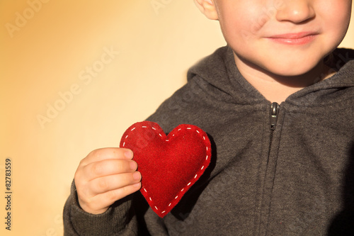 Fototapeta Naklejka Na Ścianę i Meble -  Red heart in hand