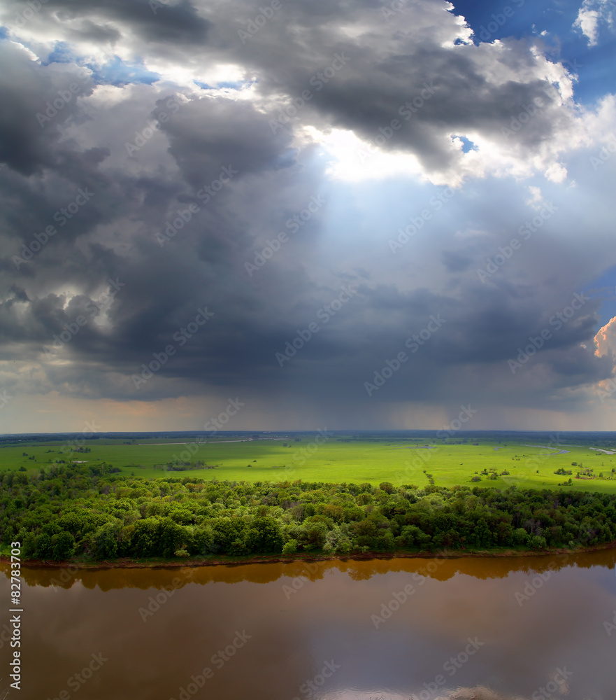 Fototapeta premium landscape with storm clouds and river