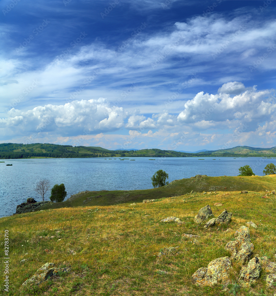 landscape with lake between hills