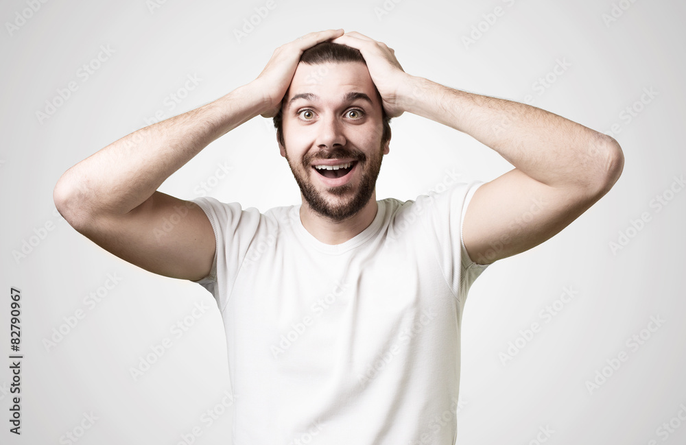 portrait of a young beautiful man surprised portrait of a young beautiful man surprised