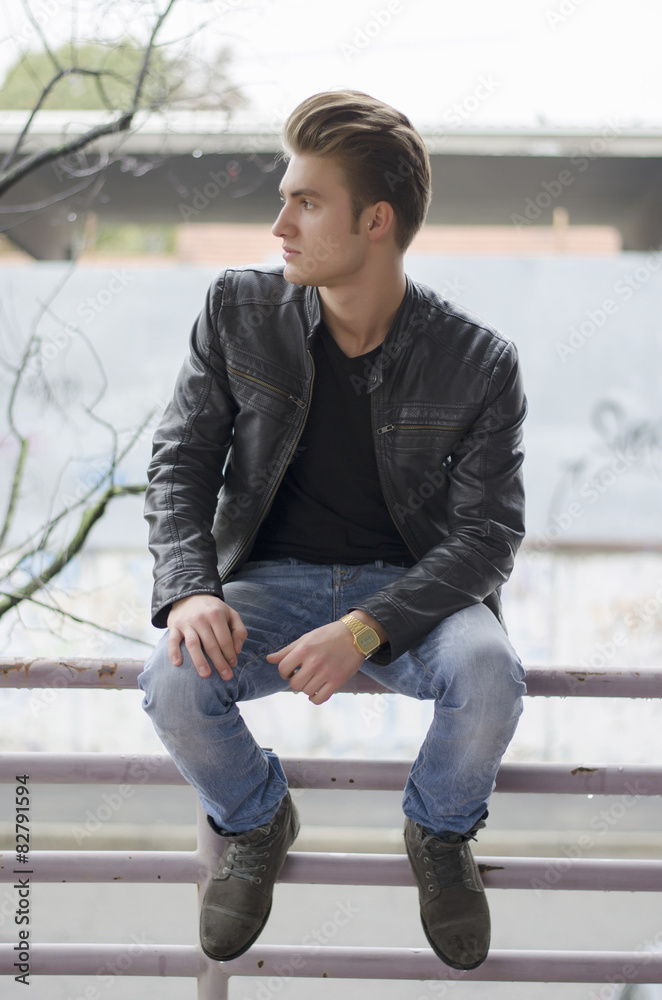 Attractive blond young man in city environment Attractive blond young man in city environment