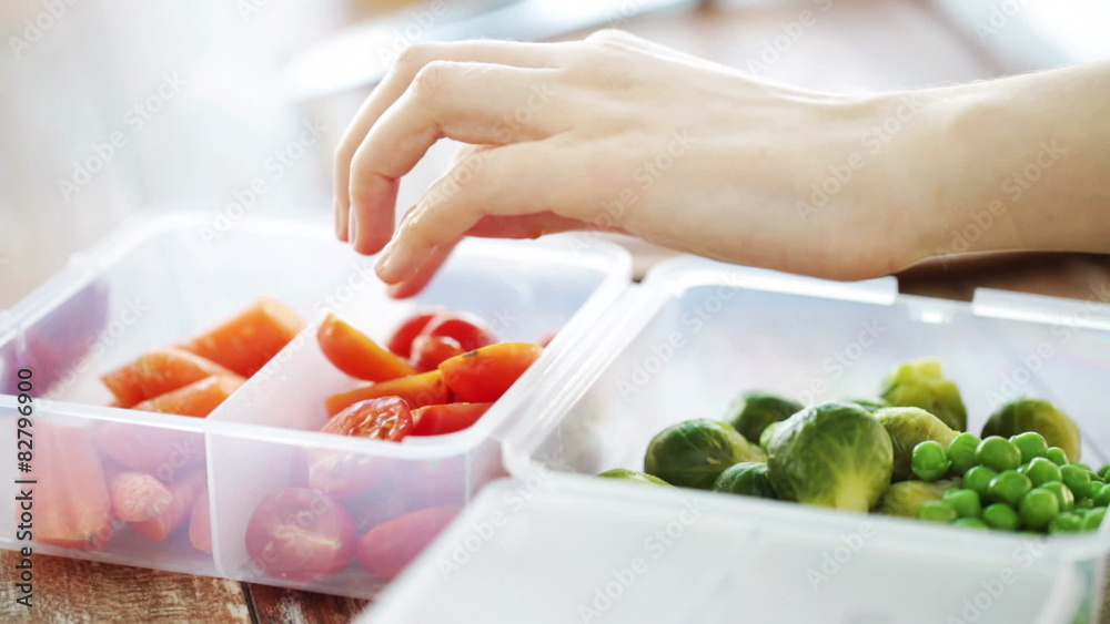 close up of woman chopping vegetables at home close up of woman chopping vegetables at home