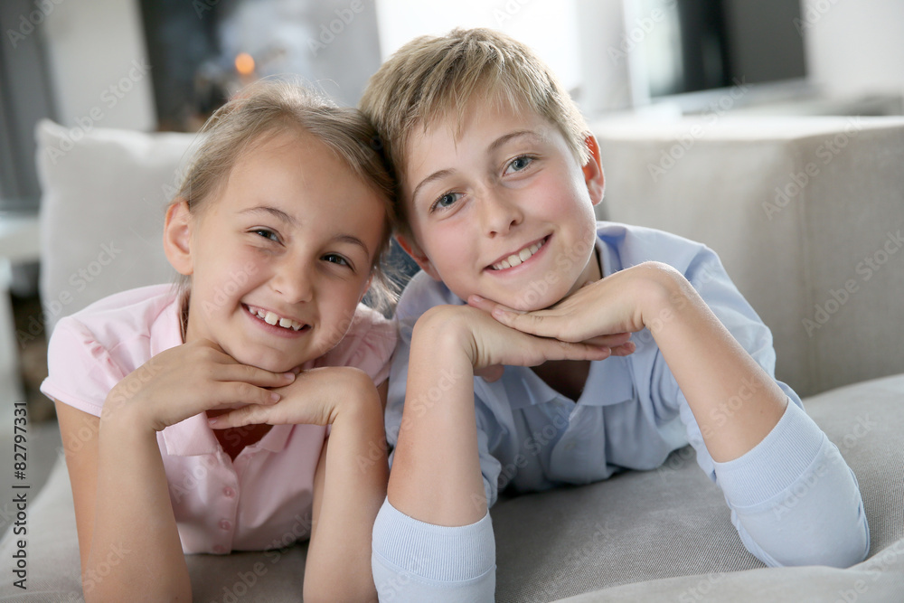Portrait of kids laying in sofa at home Portrait of kids laying in sofa at home