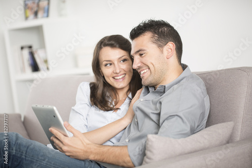 young couple using tablet pc at home © Atelier 211