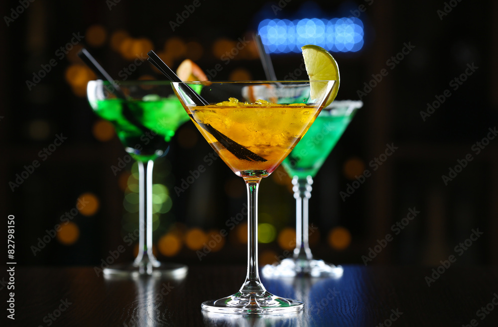 Glasses of cocktails on bar background Glasses of cocktails on bar background