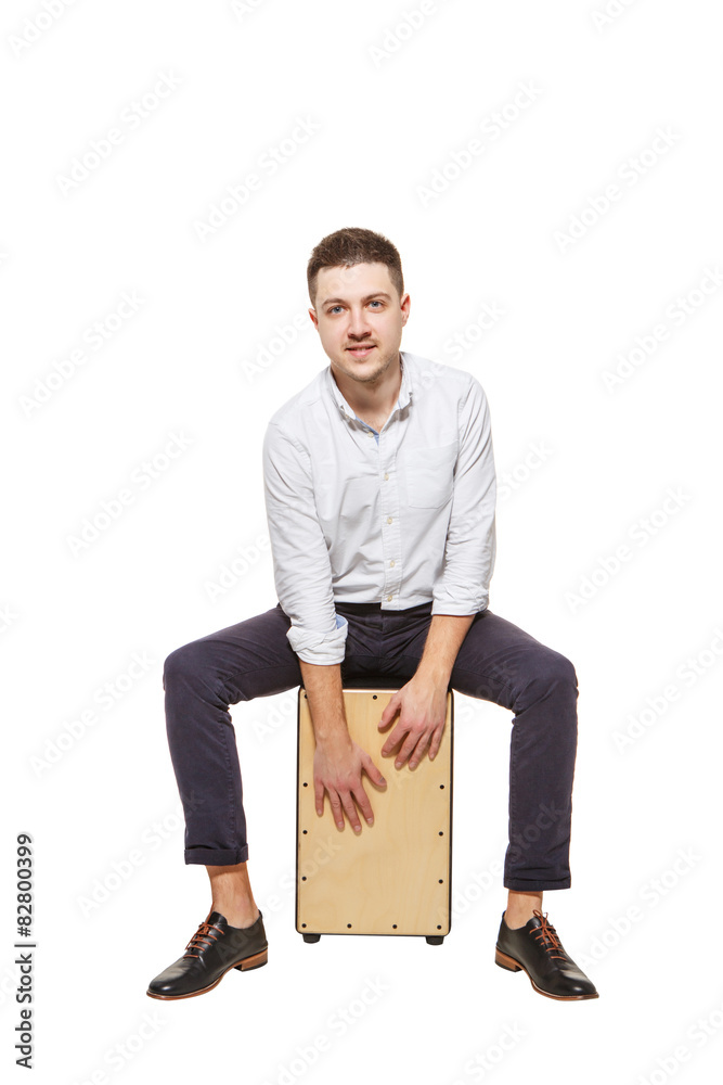 Guy playing the Cajon