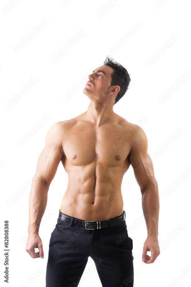 Handsome topless muscular man standing, isolated Handsome topless muscular man standing, isolated