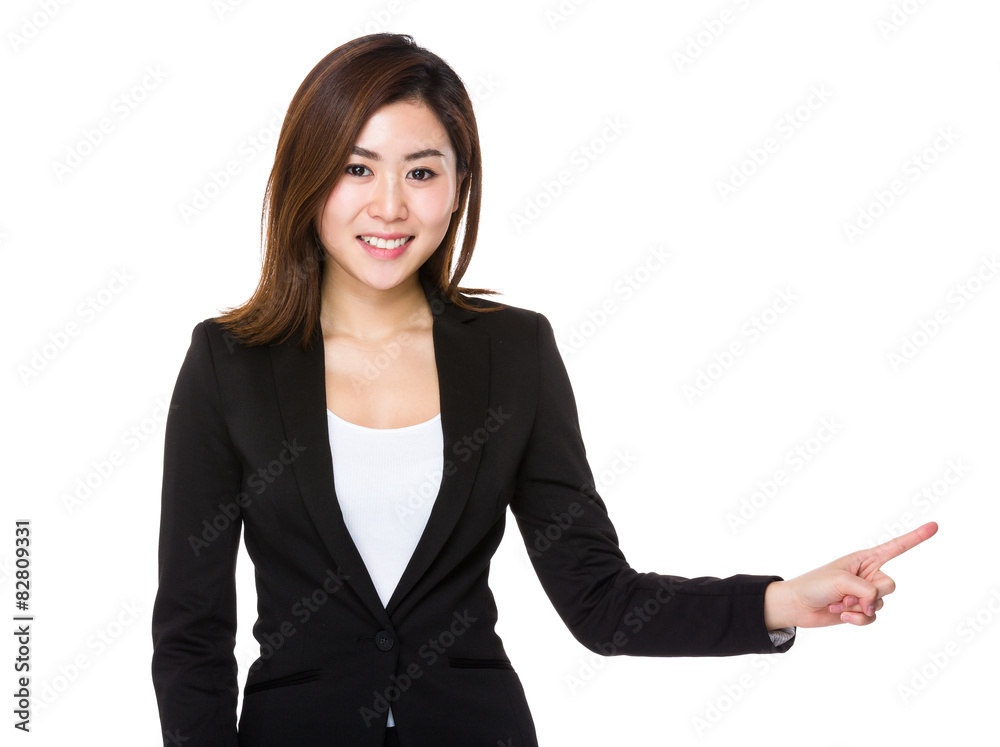 Asian businesswoman with finger point aside Asian businesswoman with finger point aside