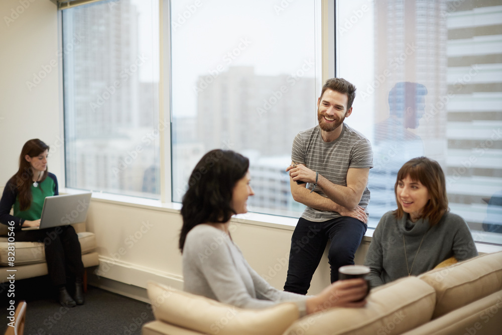 Business people talking with each other in office Business people talking with each other in office