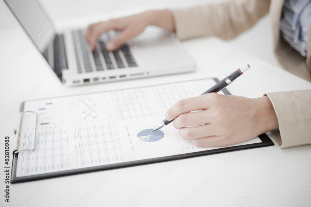 woman hand with business report woman hand with business report