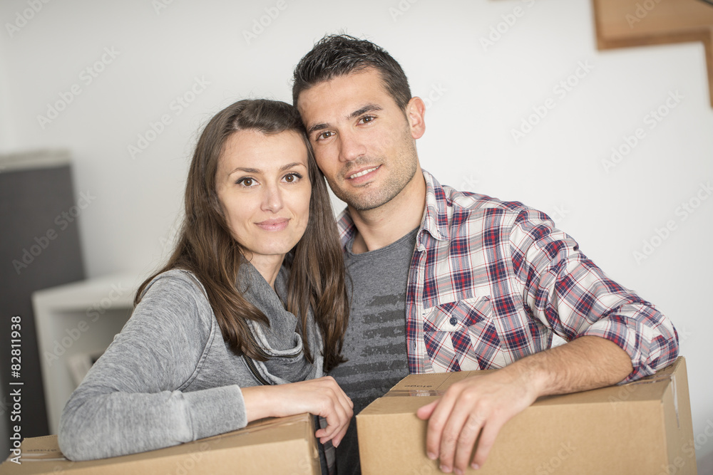 young adults moving in new home