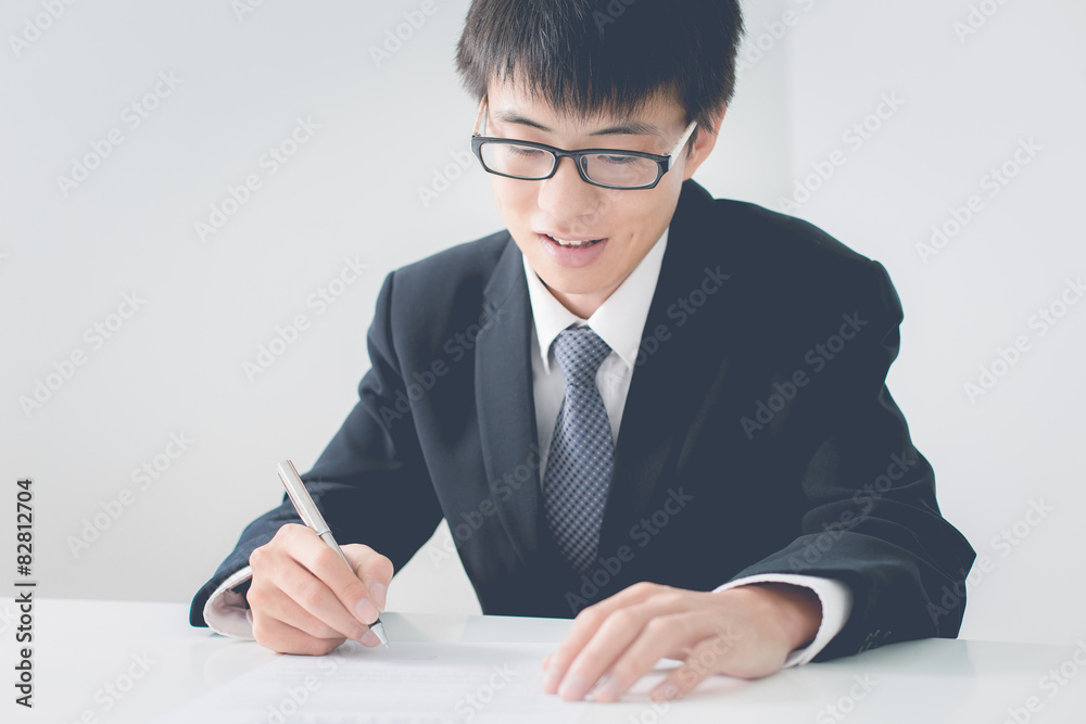 Business man signing a contract Business man signing a contract
