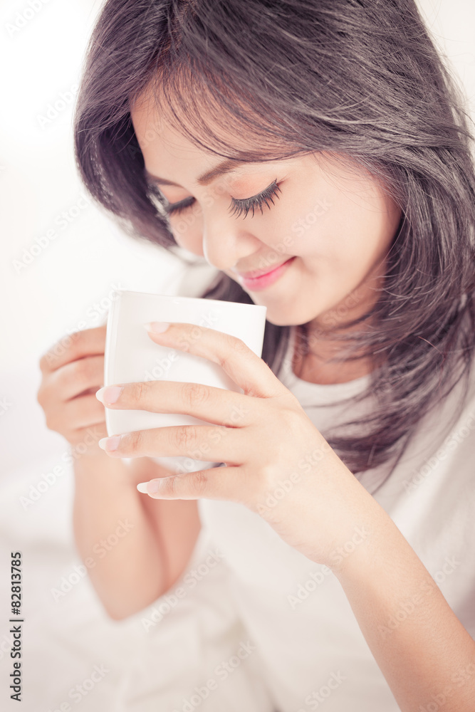 beautiful young woman hold cup of coffee lying think relaxing on beautiful young woman hold cup of coffee lying think relaxing on