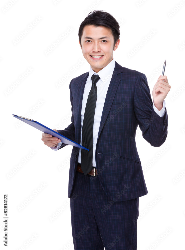 Asian businessman hold with clipboard and pen point up Asian businessman hold with clipboard and pen point up