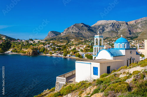 Typical for Greece white church with azure-blue dome