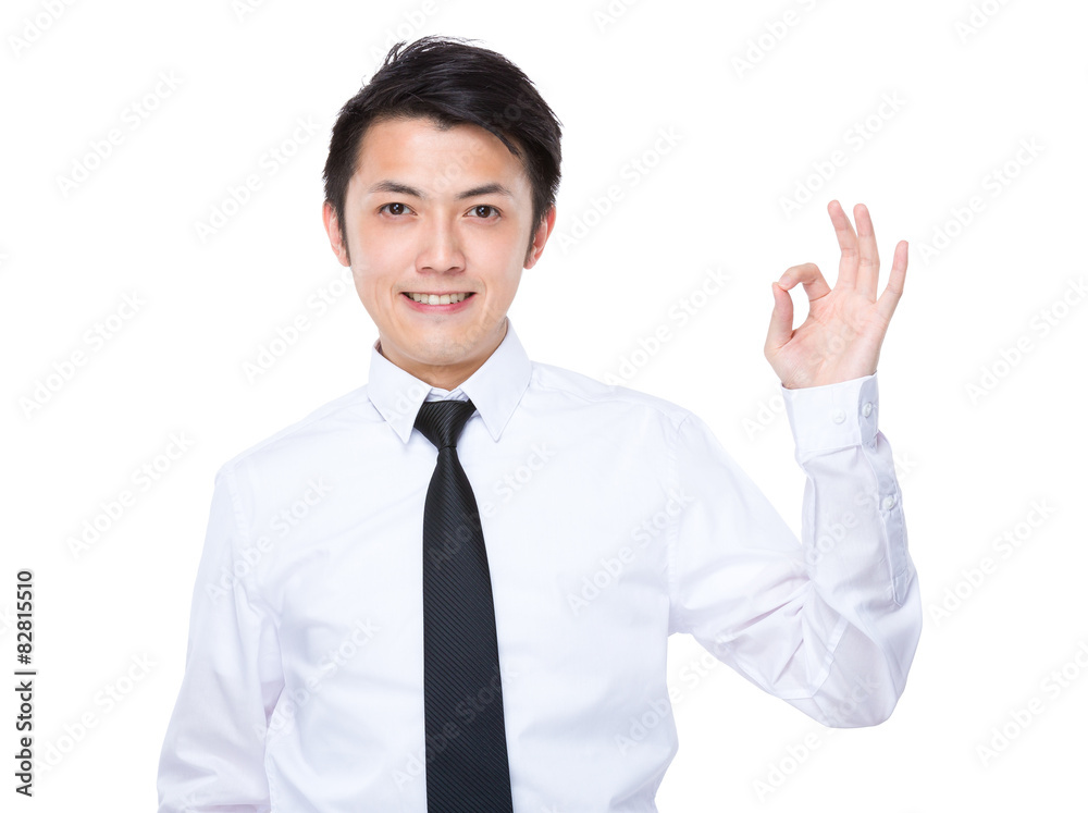 Businessman with finger showing the ok gesture Businessman with finger showing the ok gesture
