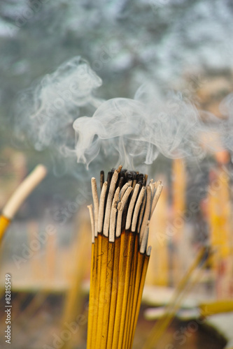 Smoldering incense sticks photo