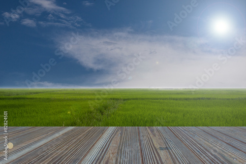 wooden table and rice field with the nature background