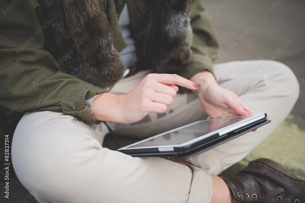 close up of woman hands using tablet device connected online wir
