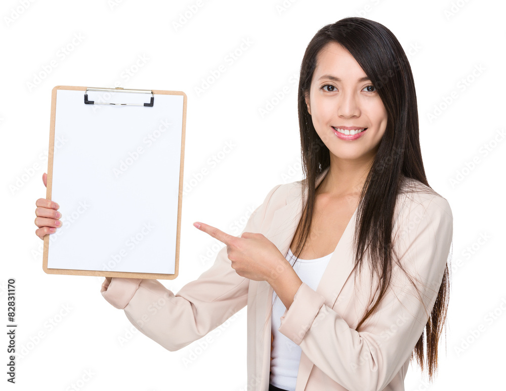 Asian businesswoman with finger point to clipboard Asian businesswoman with finger point to clipboard