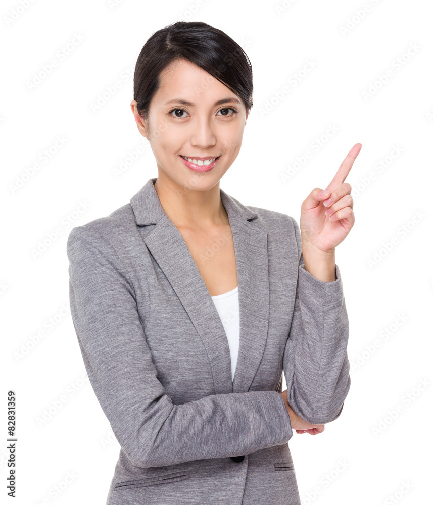 Young businesswoman with finger point upwards Young businesswoman with finger point upwards