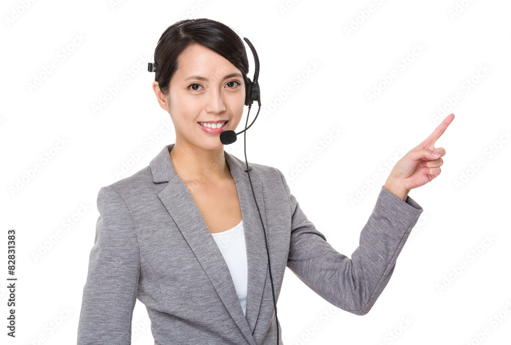 Businesswoman with headset and finger point up Businesswoman with headset and finger point up