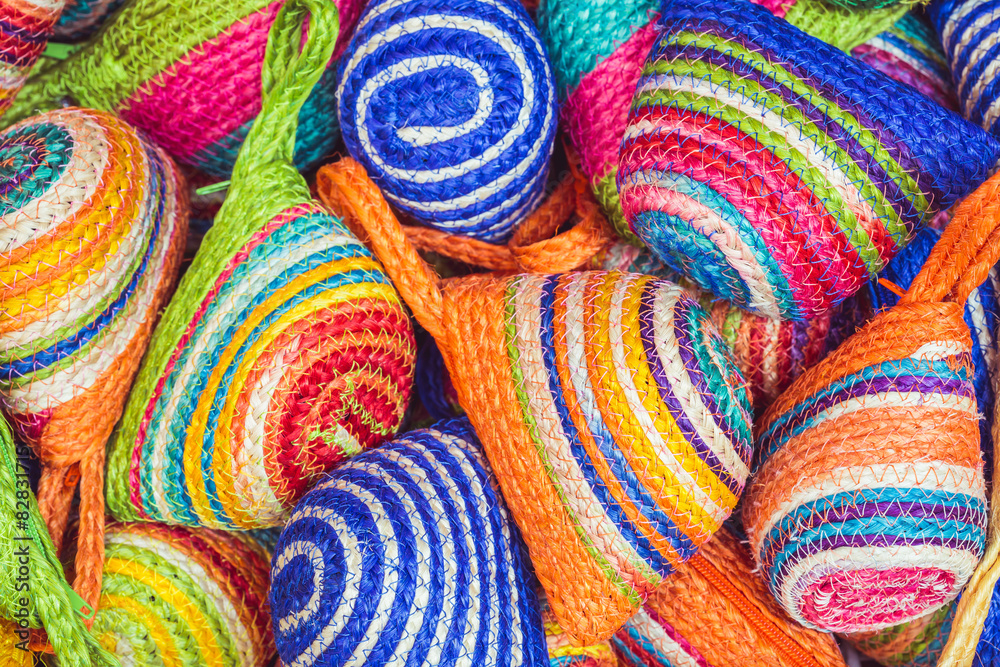 Close up stack of colorful handmade coin bag in market