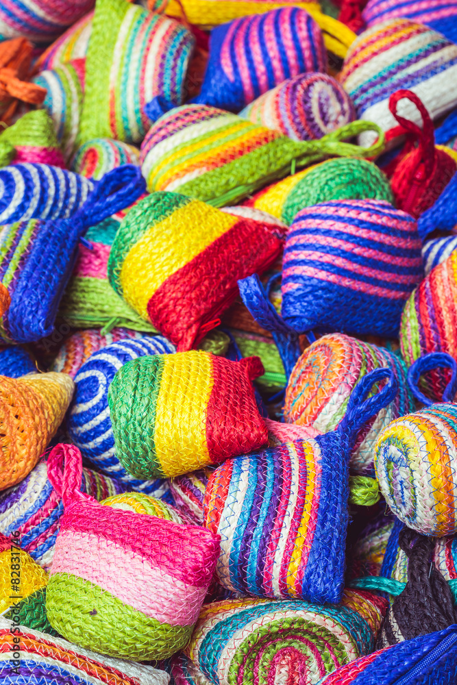 Close up stack of colorful handmade coin bag in market Close up stack of colorful handmade coin bag in market