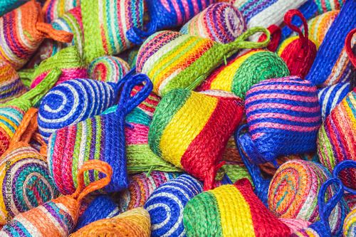 Close up stack of colorful handmade coin bag in market