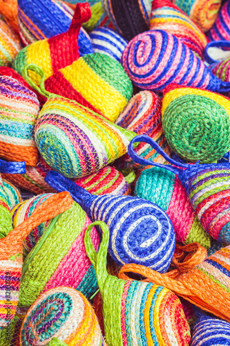 Close up stack of colorful handmade coin bag in market