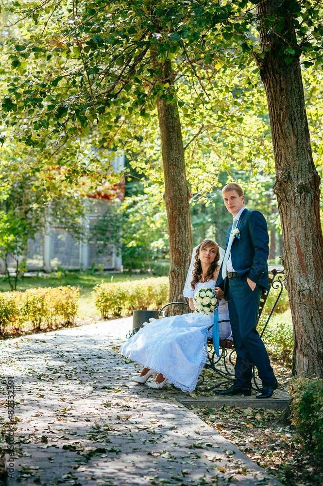 Fototapeta premium Bride and Groom at wedding Day walking Outdoors on spring nature
