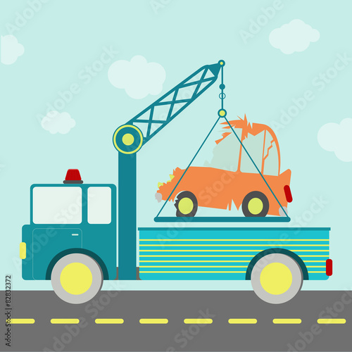 Tow truck carrying a crashed car on the road.