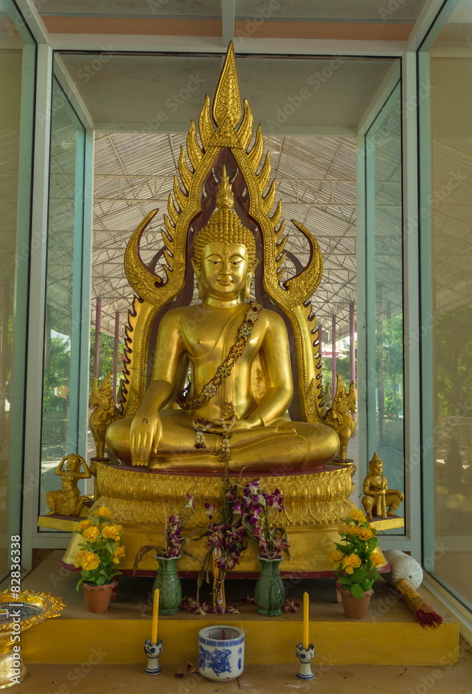 gold buddha statue sitting with candlestick and incense burner gold buddha statue sitting with candlestick and incense burner
